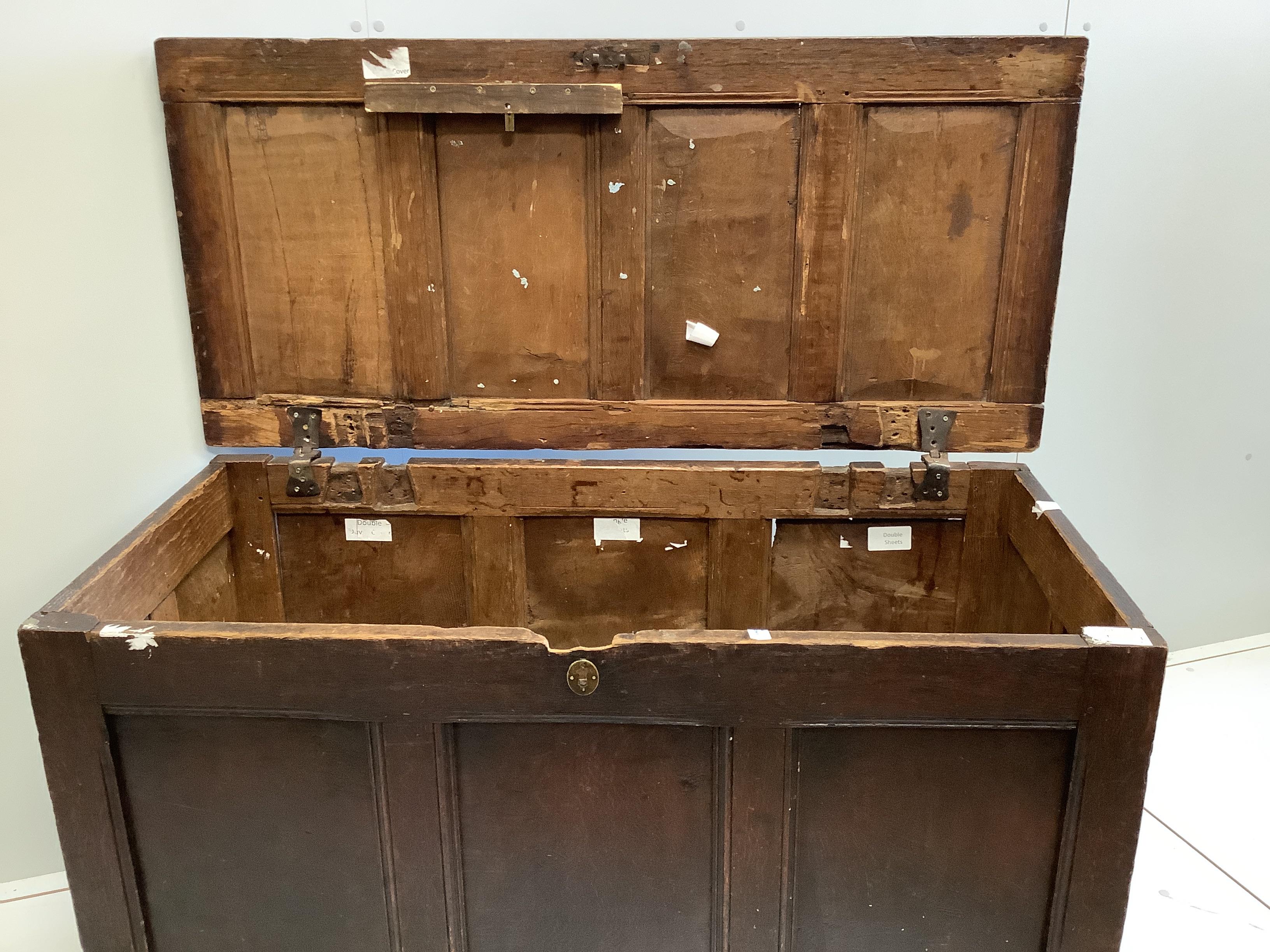 An early 18th century panelled oak coffer, width 126cm, depth 59cm, height 73cm